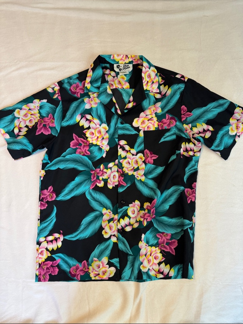 Hilo Hattie Black Hawaiian Shirt with Teal Leaves and Pink & Yellow Flowers